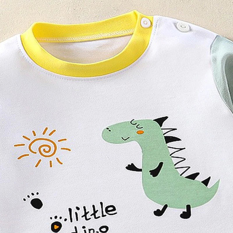 Baby onesie with dinosaur and sun design on a white background