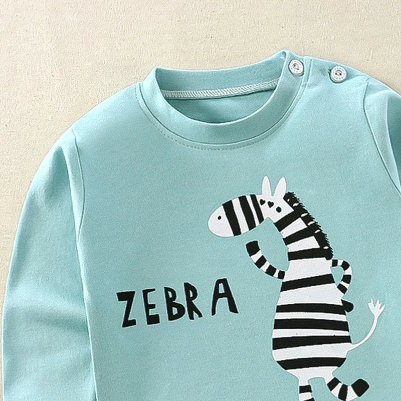 Light blue shirt with zebra design and 'Zebra' text on a beige background